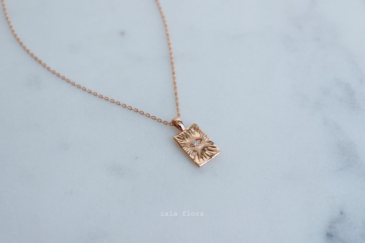 Isla Flora Protective Eye in Textured Tag Necklace